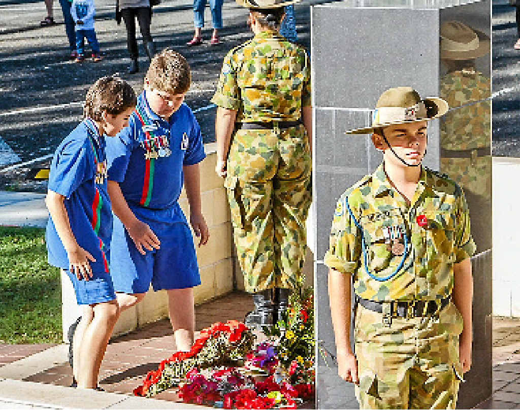 RESPECT: Widgee State Primary School captains Devin Cooksley and Liam Clune place a wreath on Anzac Day. RESPECT: Widgee State Primary School captains Devin Cooksley and Liam Clune place a wreath on Anzac Day.